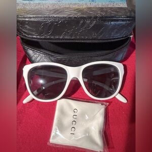 Gucci sunglasses with gucci cloth. Not sure about brand on case Great condition